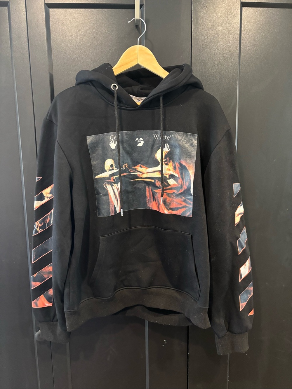 Off-White Replica Black Hoodie with Red-Orange Graphic and Diagonal Sleeve